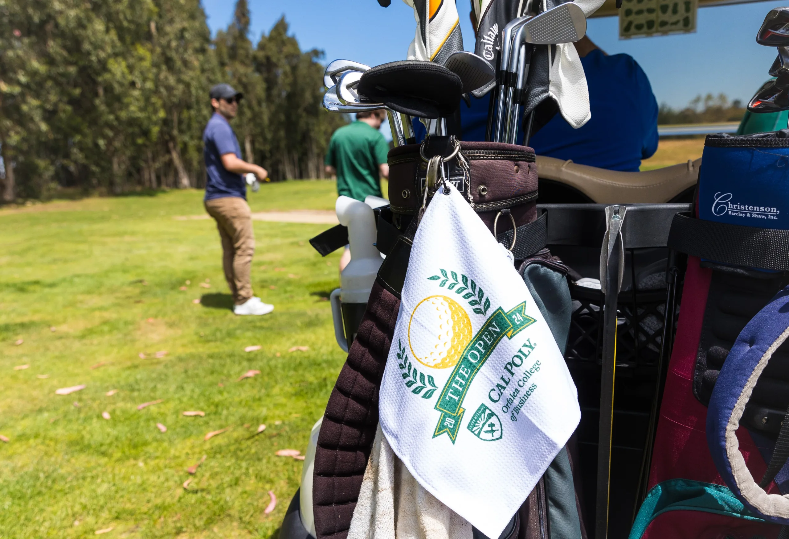 Detail shot of golf clubs and a towel