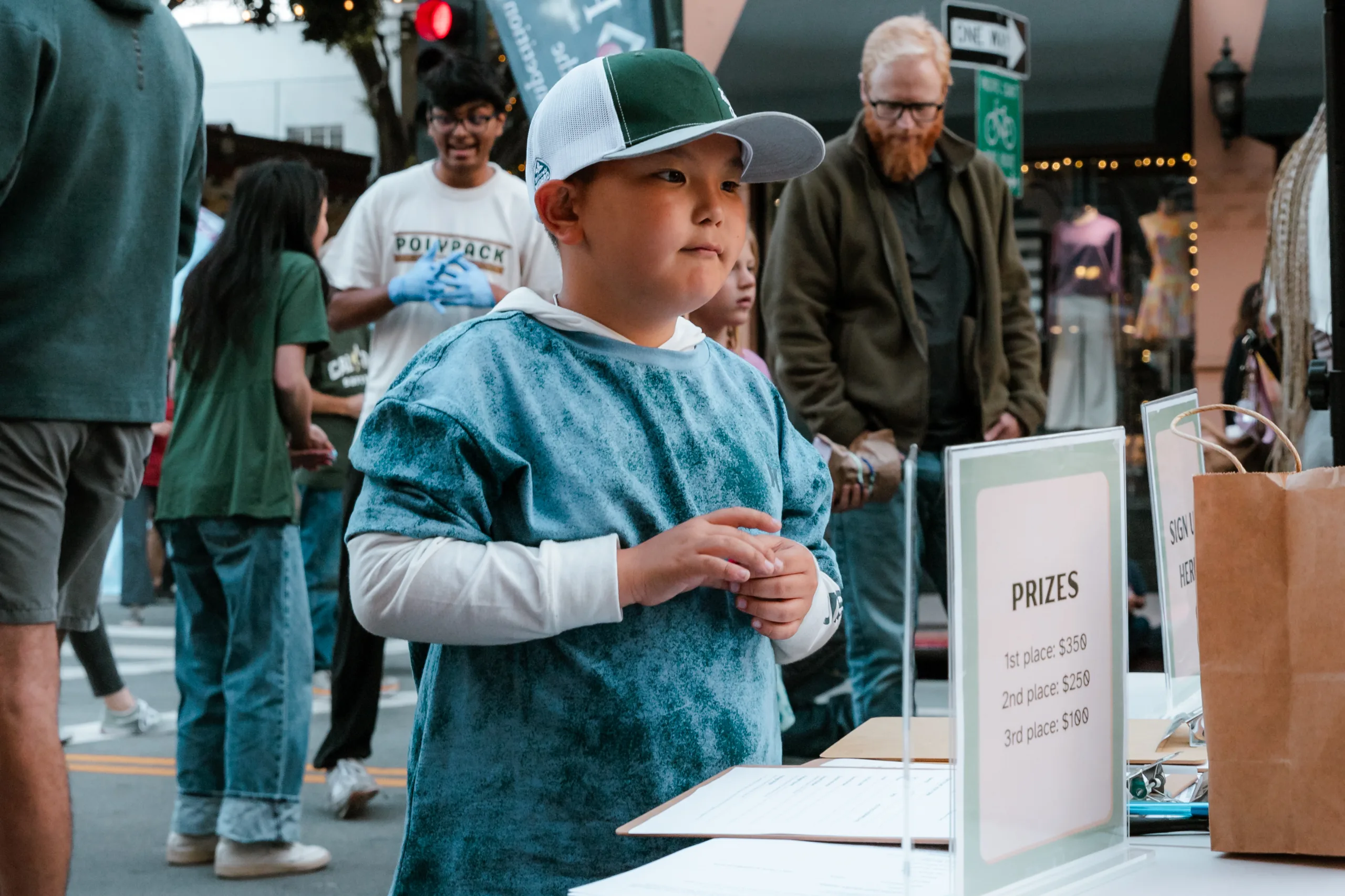 A boy gets ready for tje egg drop contest, waiting in line to sign up