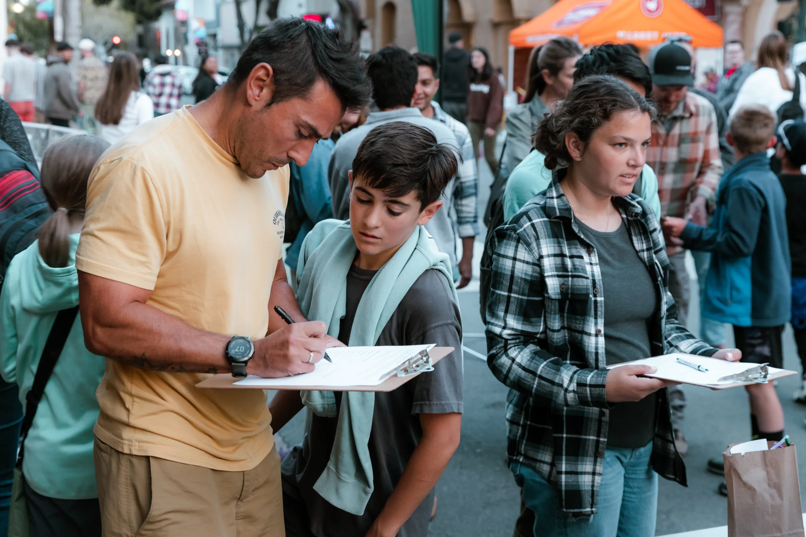 A father and son sign up for the egg drop contest