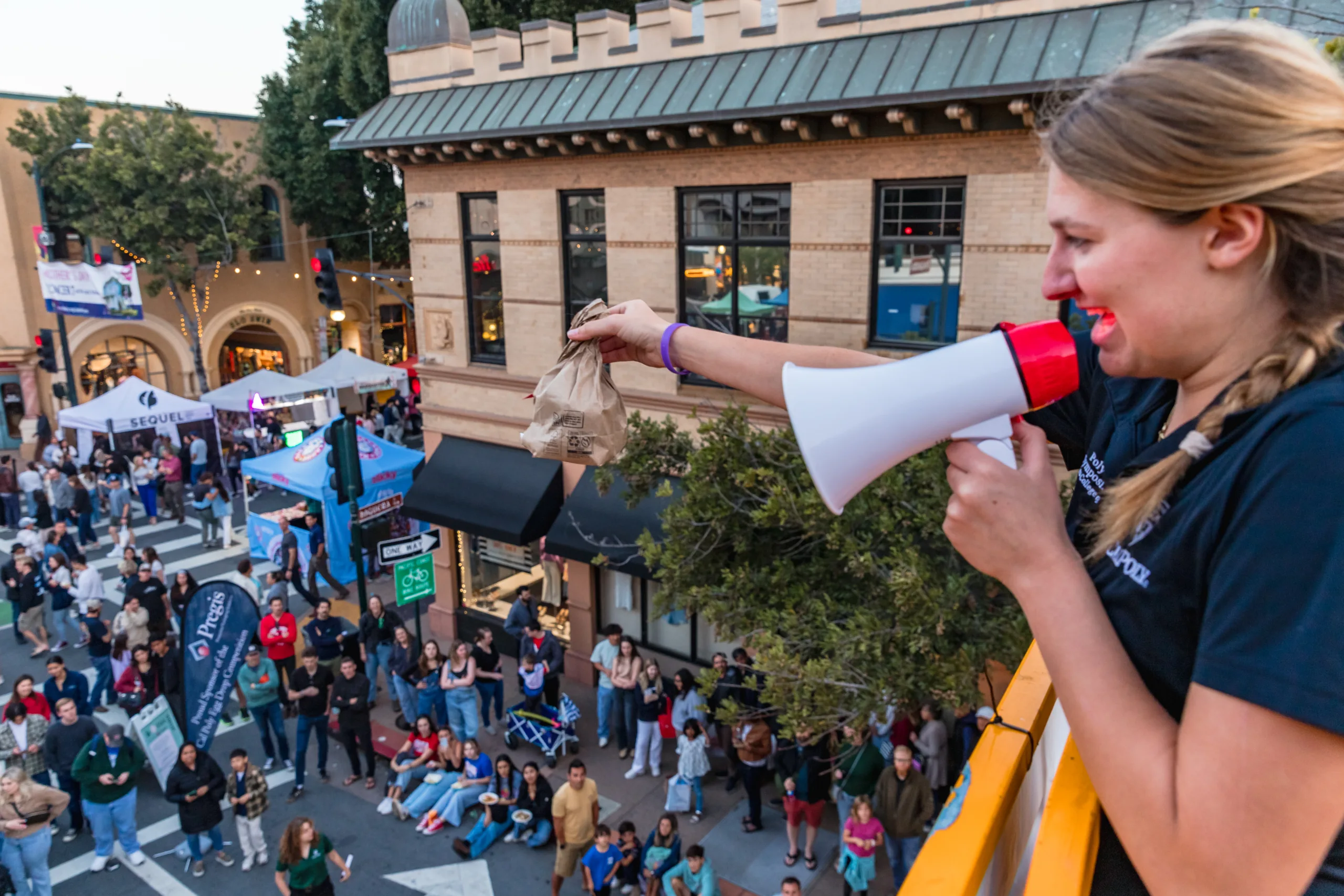 A student in the Poly Pack club prepares to drop an egg package from 30 feet