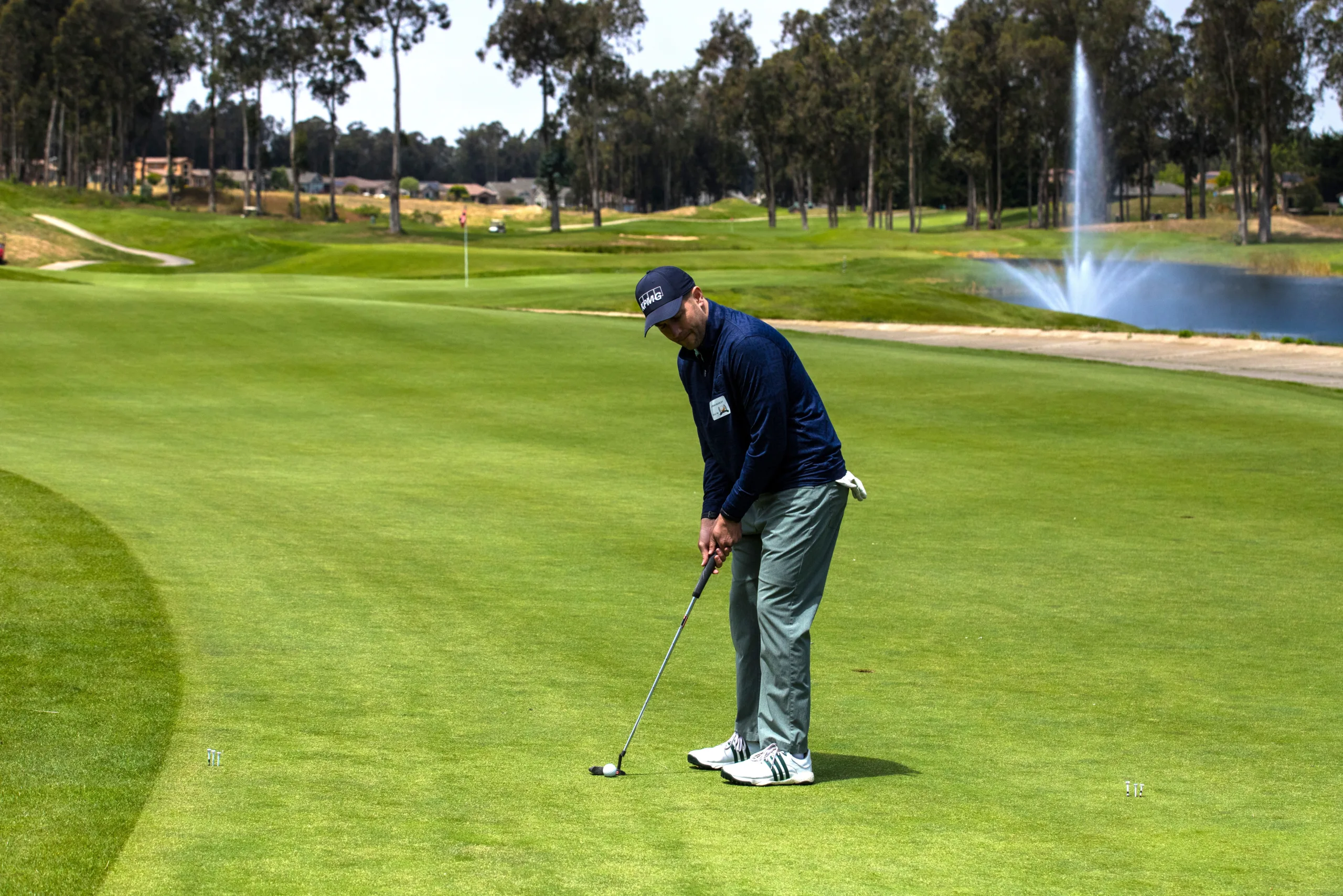 A golfer putts