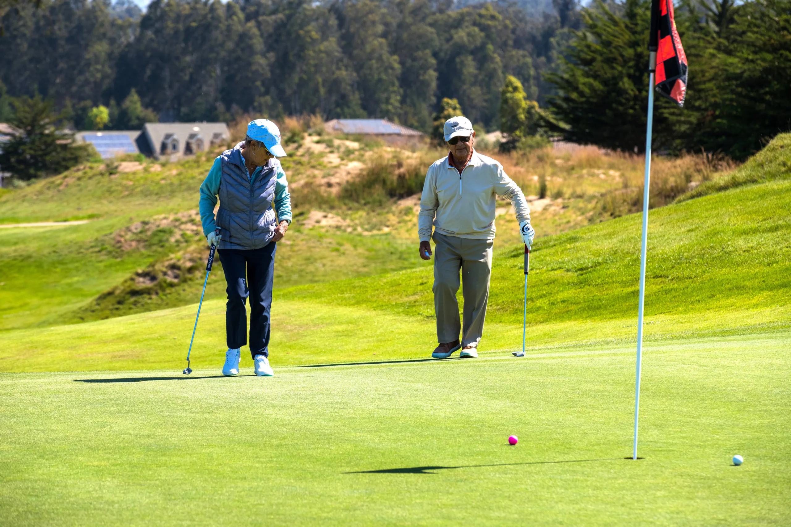 golfers on a putting green