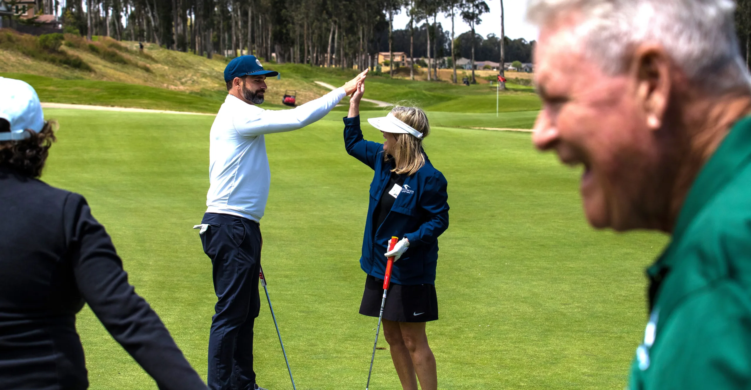 Golfers offer a high five