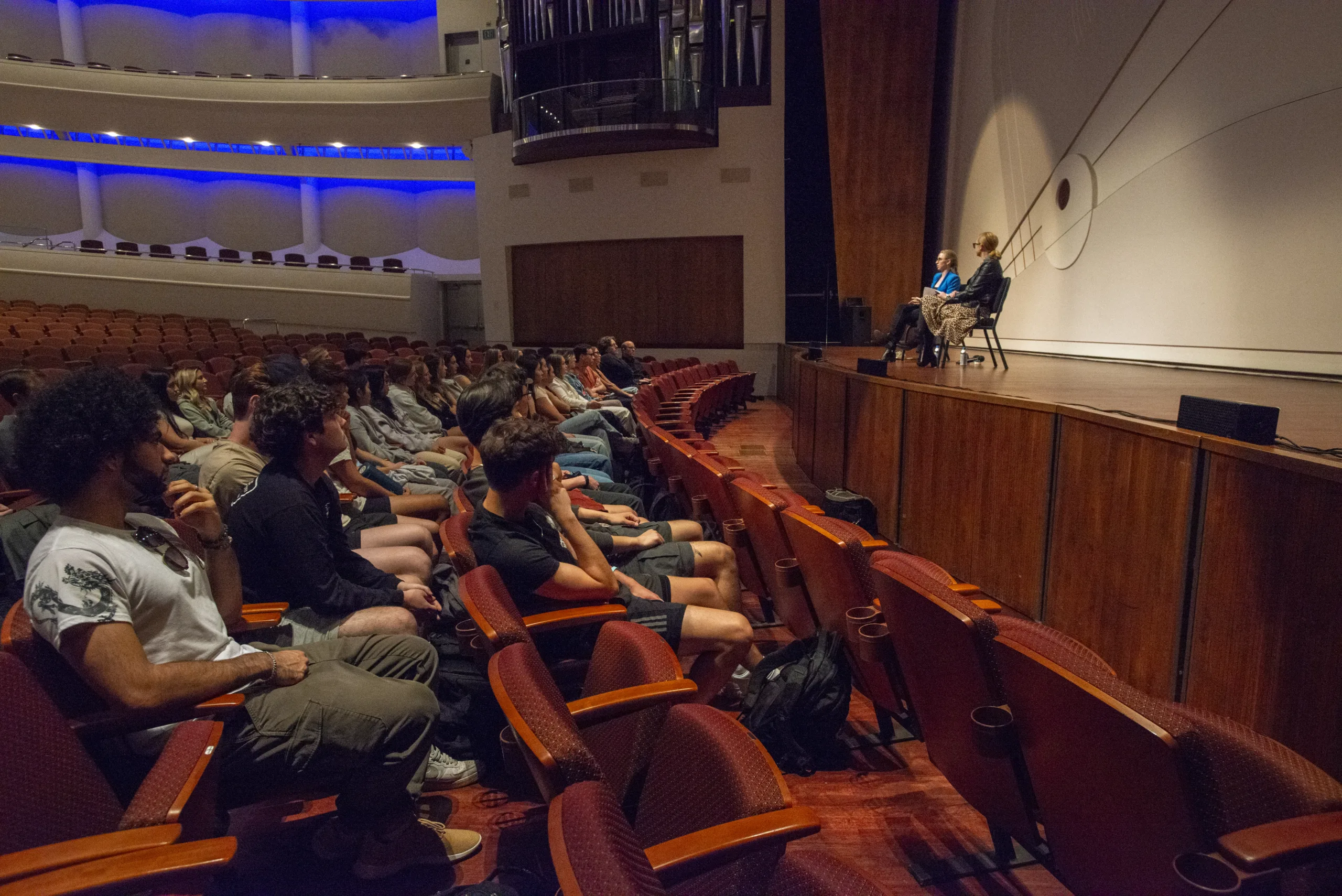 Two speaker discuss marketing oin a stage