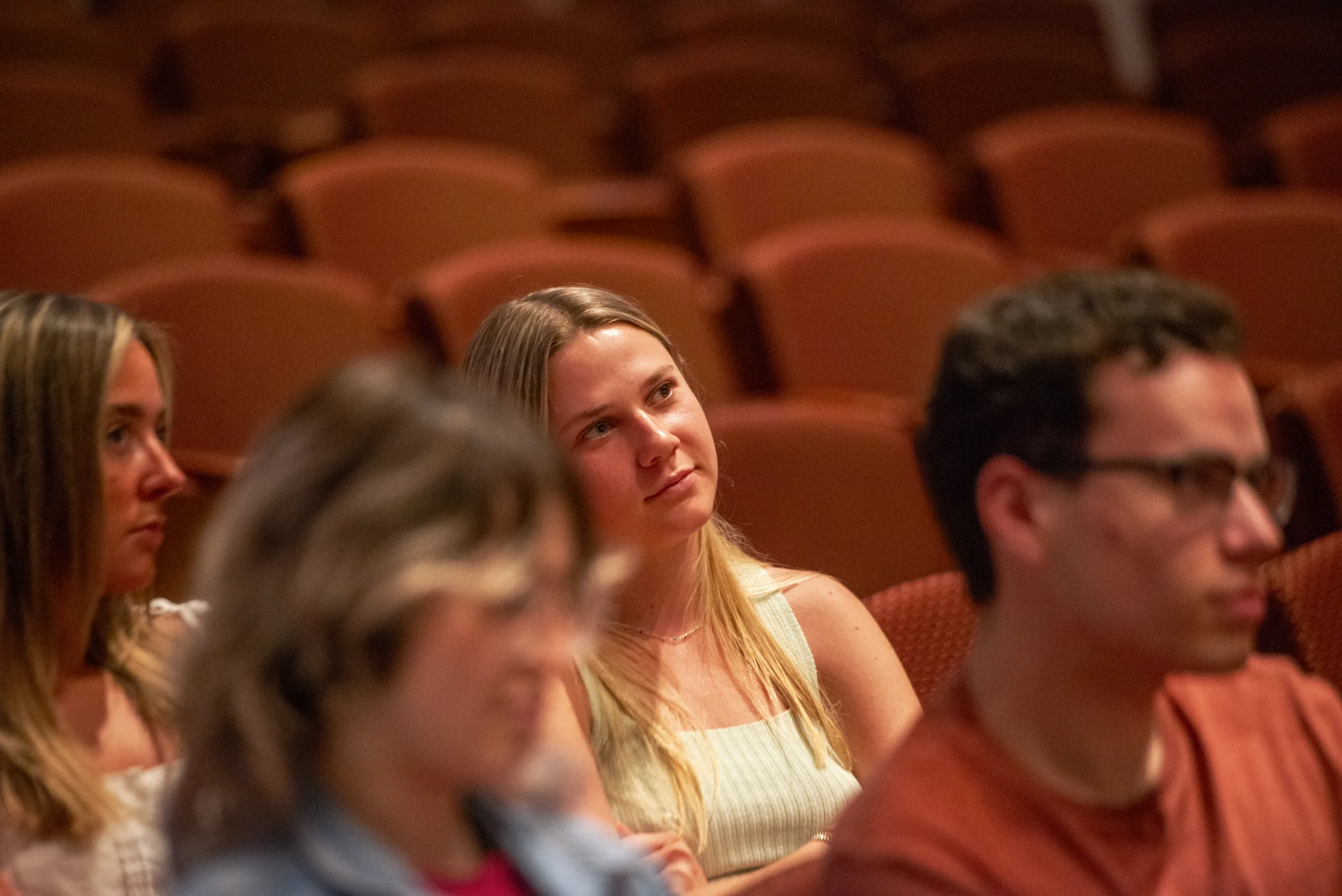 An audience mameber watches a presentation