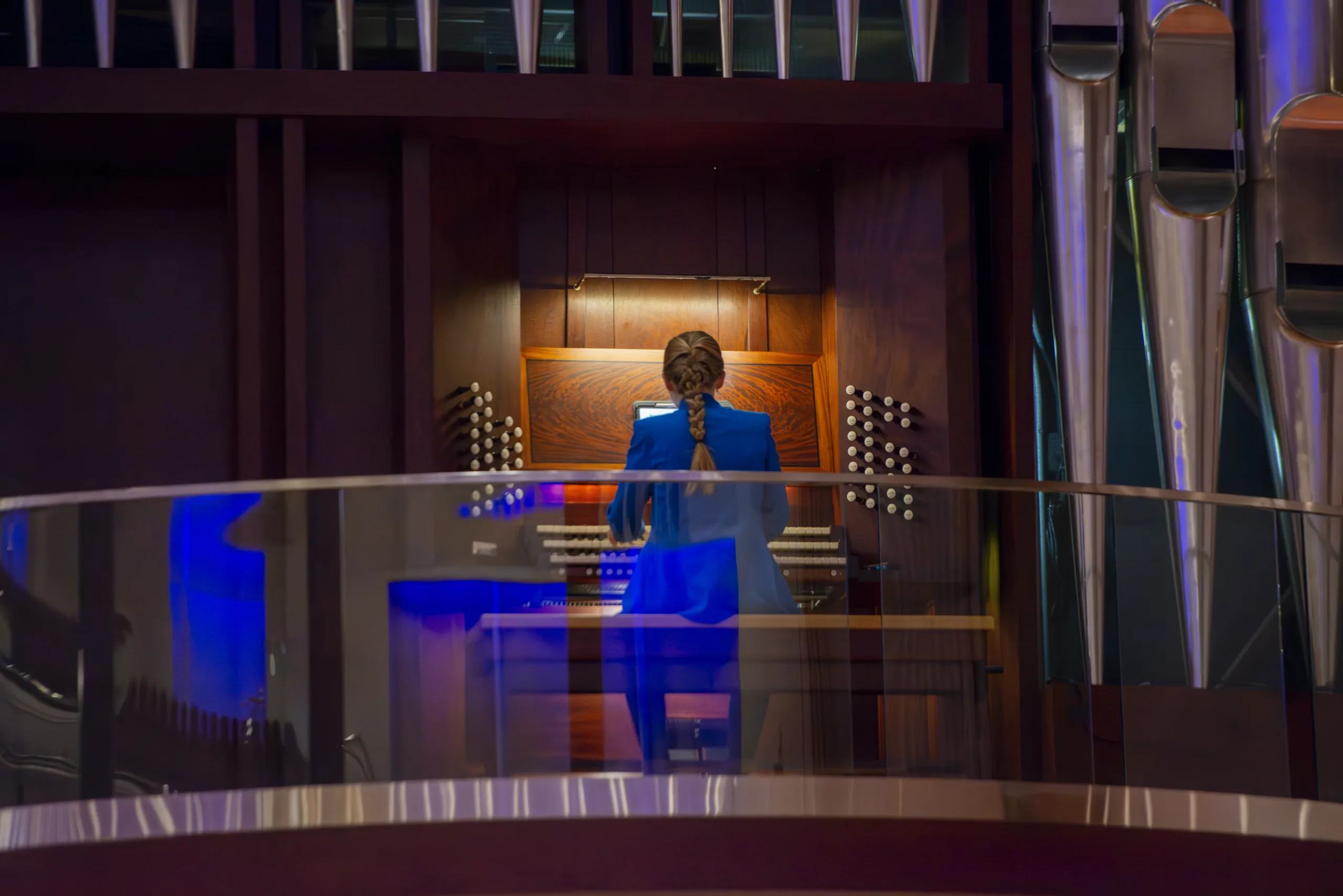 An organist performs on a pipe organ