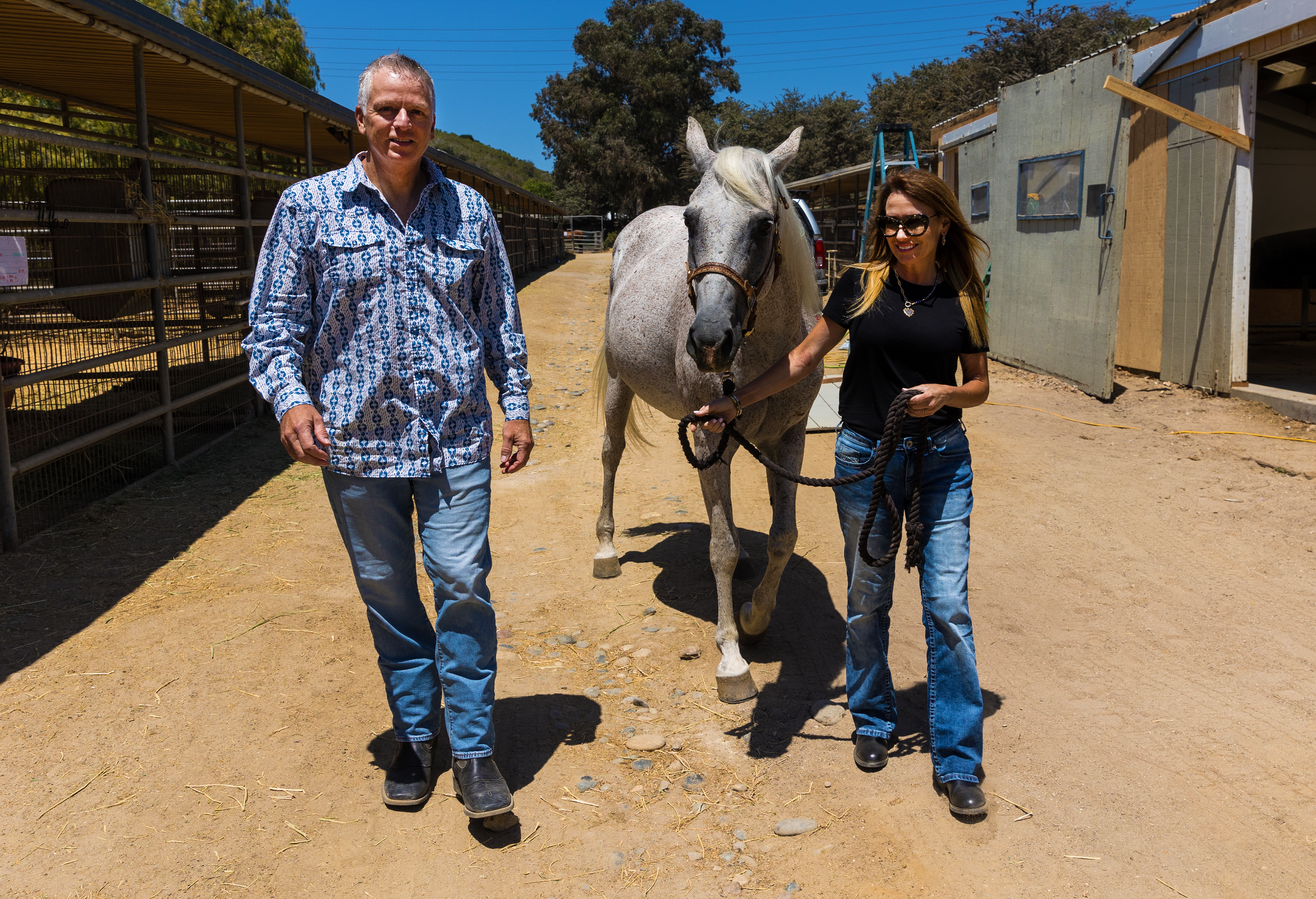 Simon and Caprice Arkell lead a horse