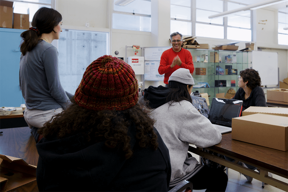 A faculty member engaging with students