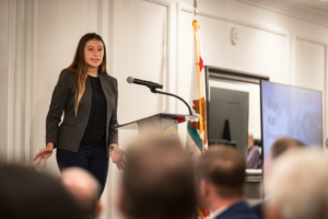 Maya Karl speaking at a conference
