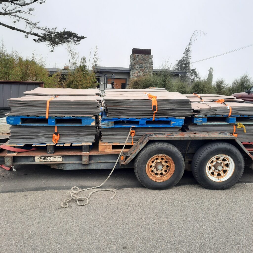 A pallet of flooring materials prepared for haul