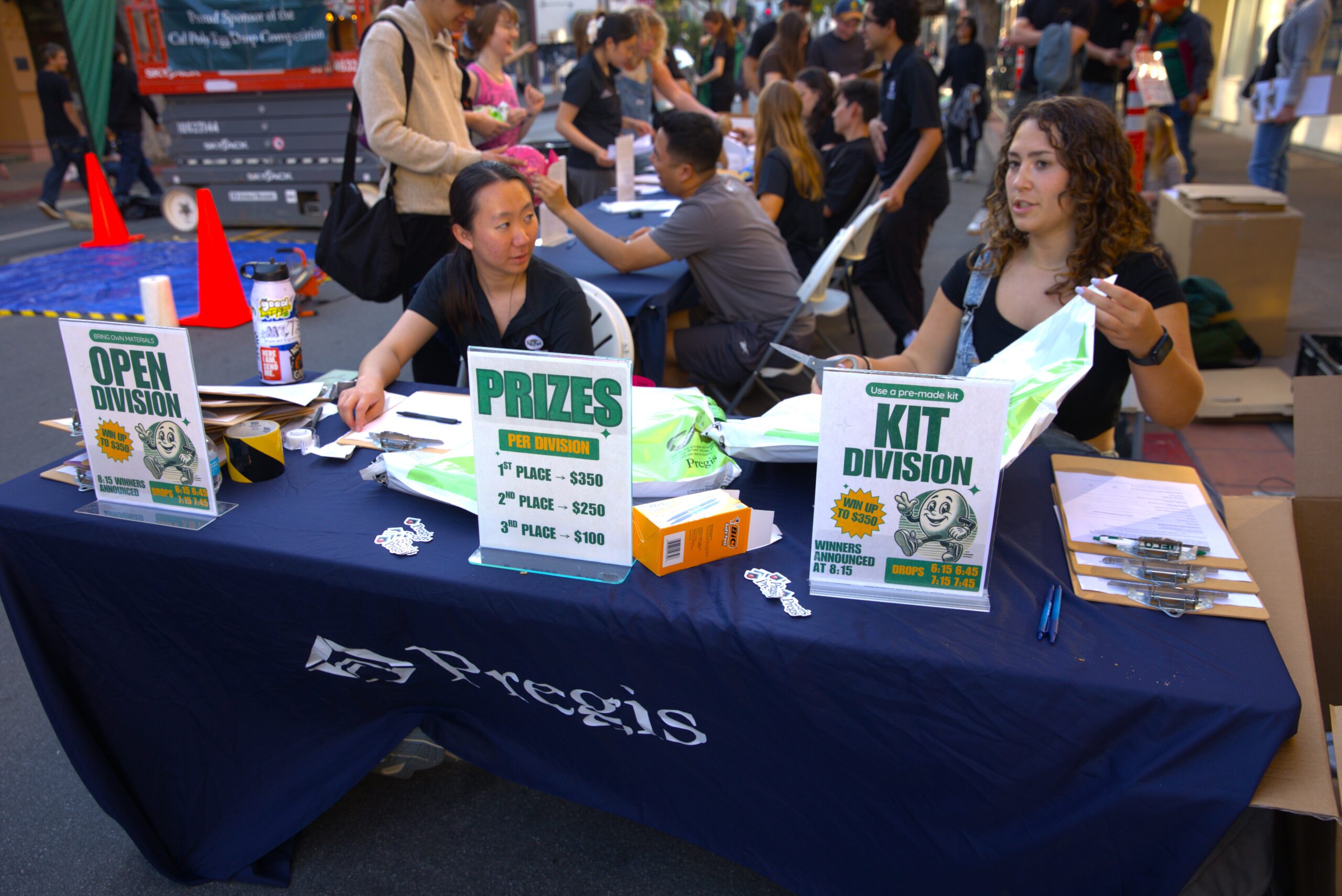 Members of the Poly Pack club sign contestants up at a table at the SLO Farmer's Market