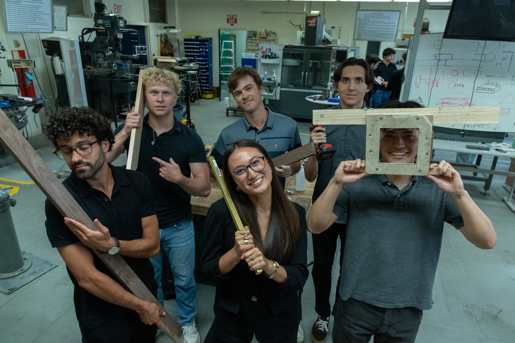 A capstone team poses for a fun portrait