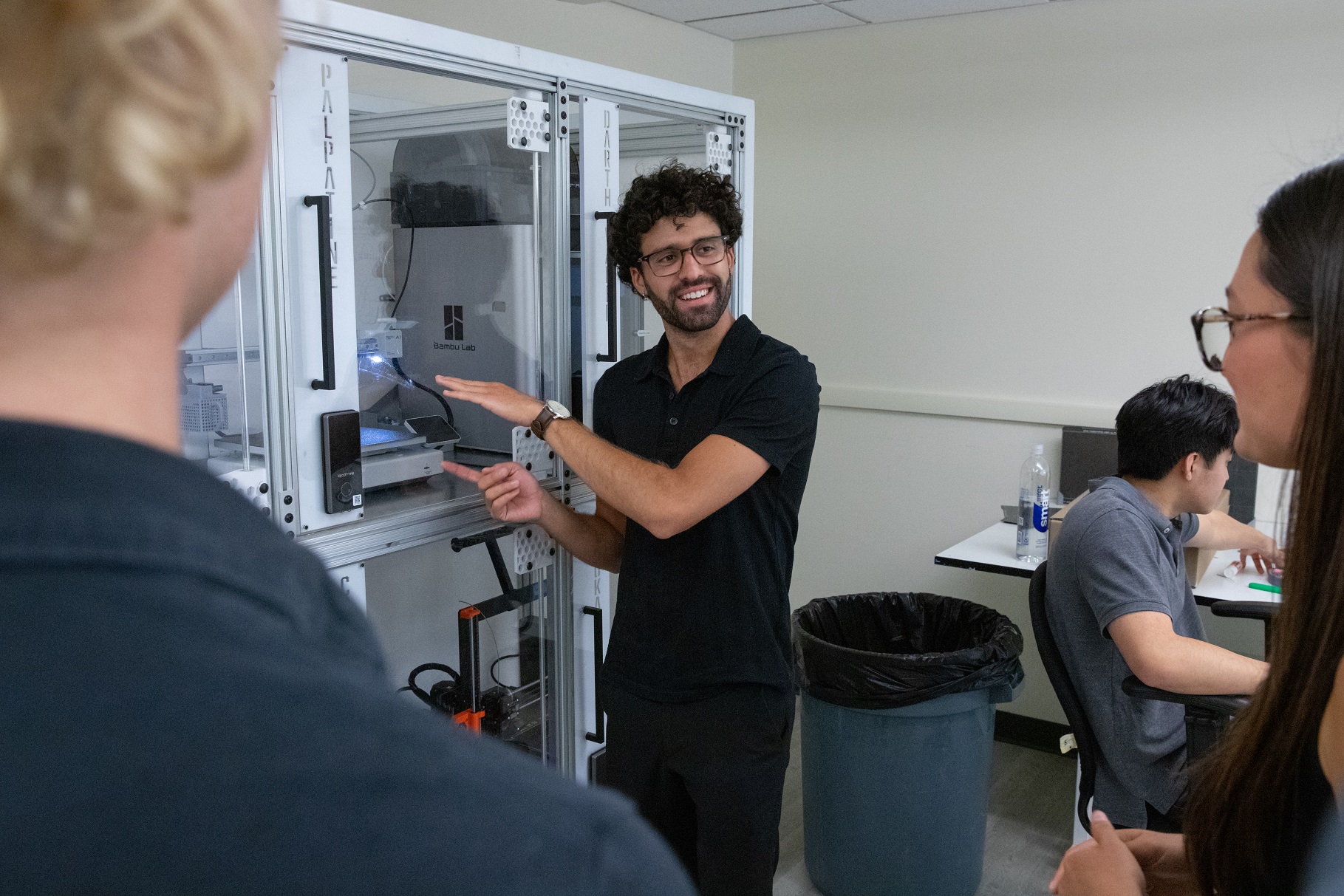 A student demonstrates a machine in an ITP lab