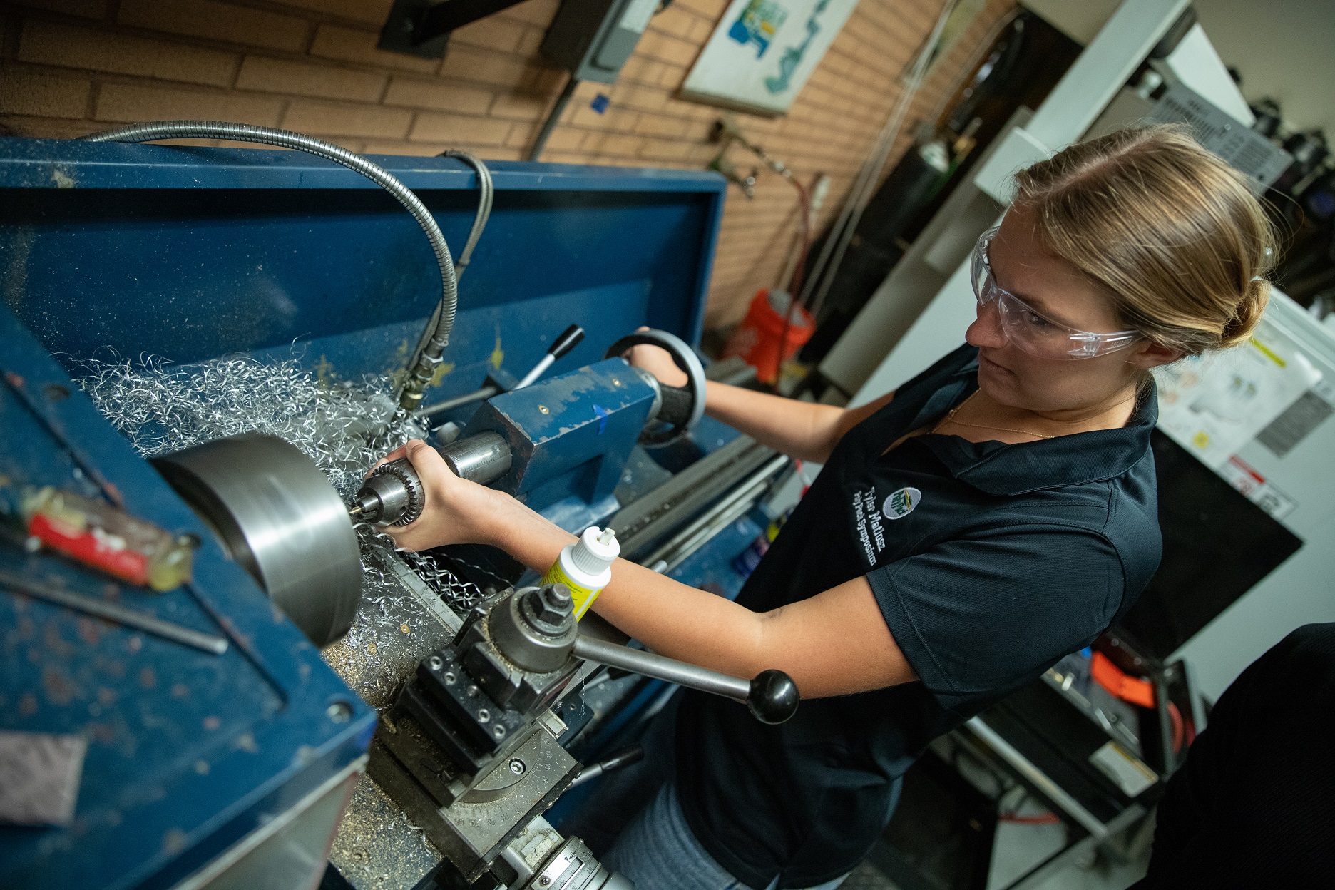 Overhead of a student working on a machine