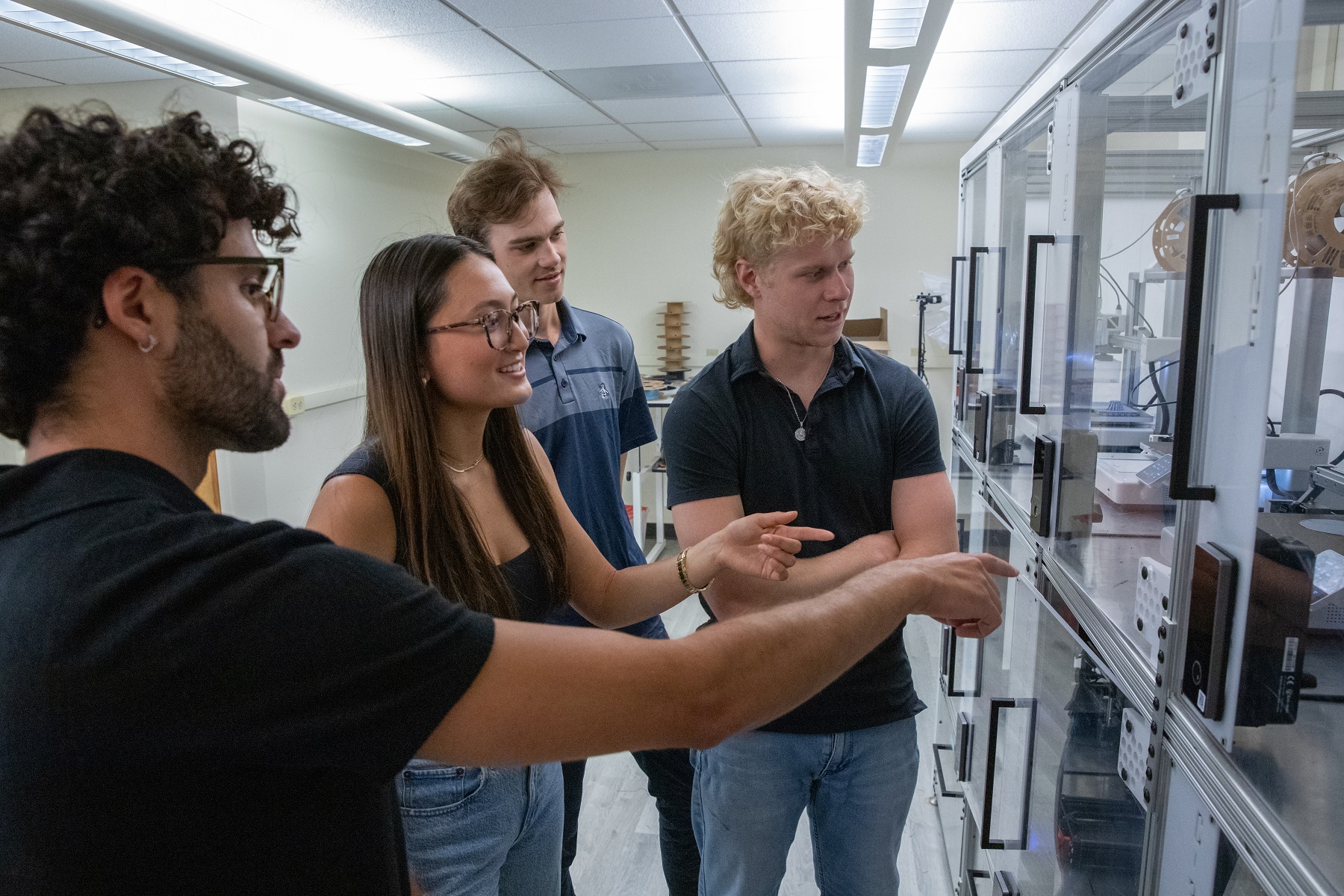 Students look over new equipment in the ITP lab