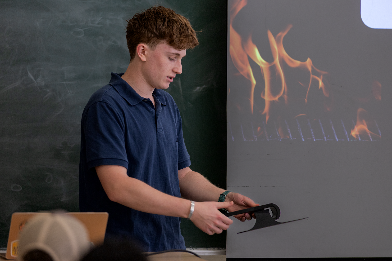 A student offers a demonstration of his team's capstone project