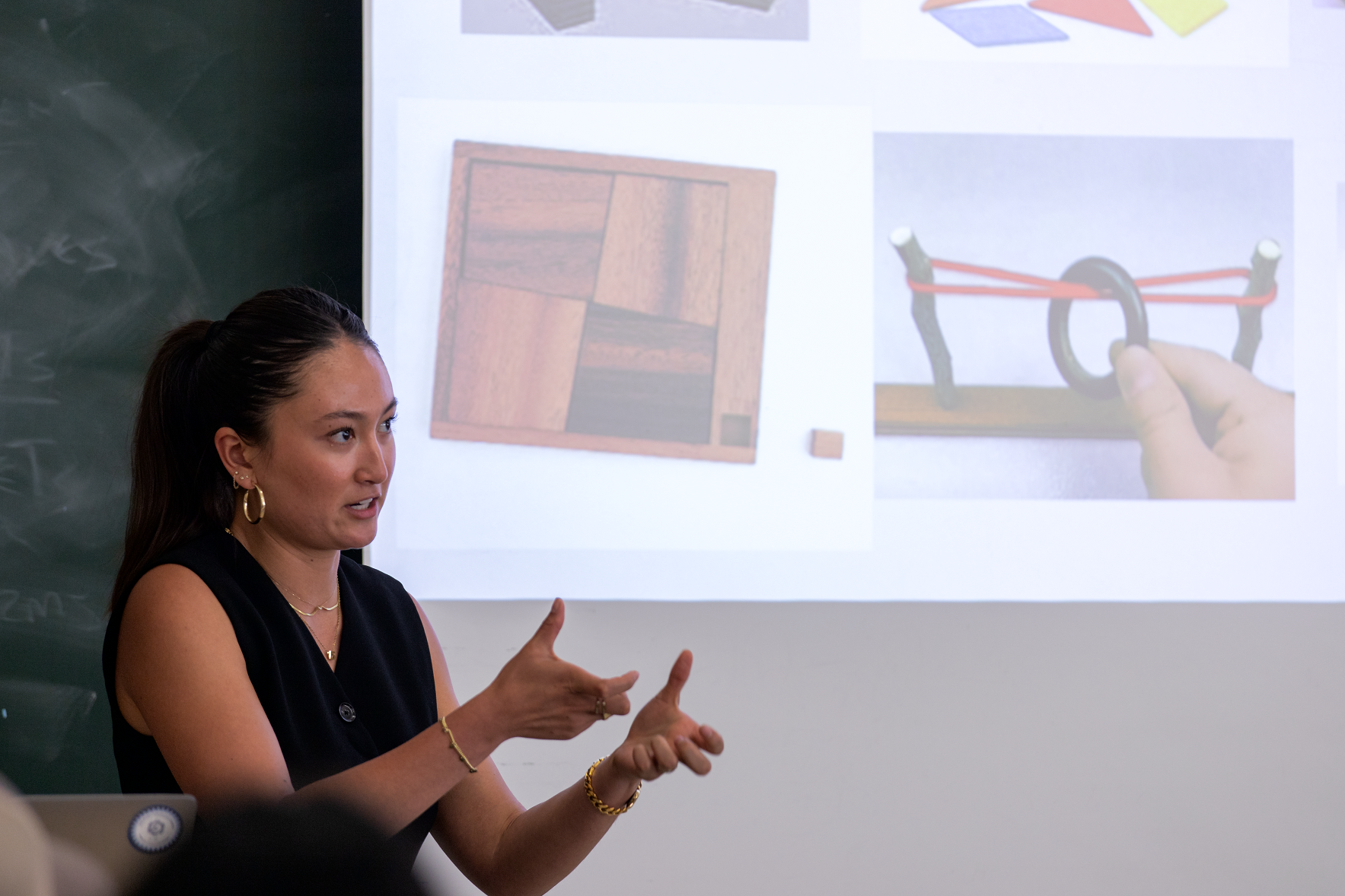 A student gives a PowerPoint on her capstone project
