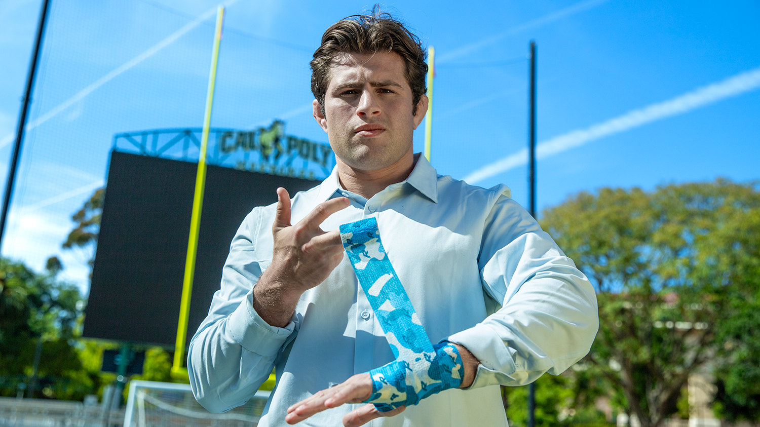 An MBA student demonstrates his athletic tape at the Spanos Stadium