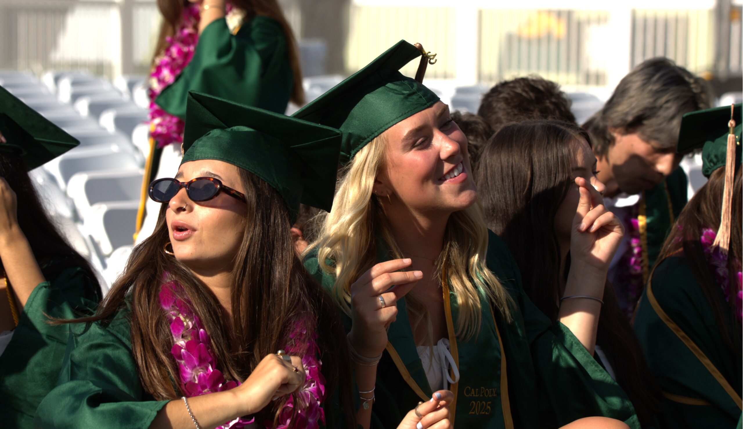 Students dance in their seats during commencement