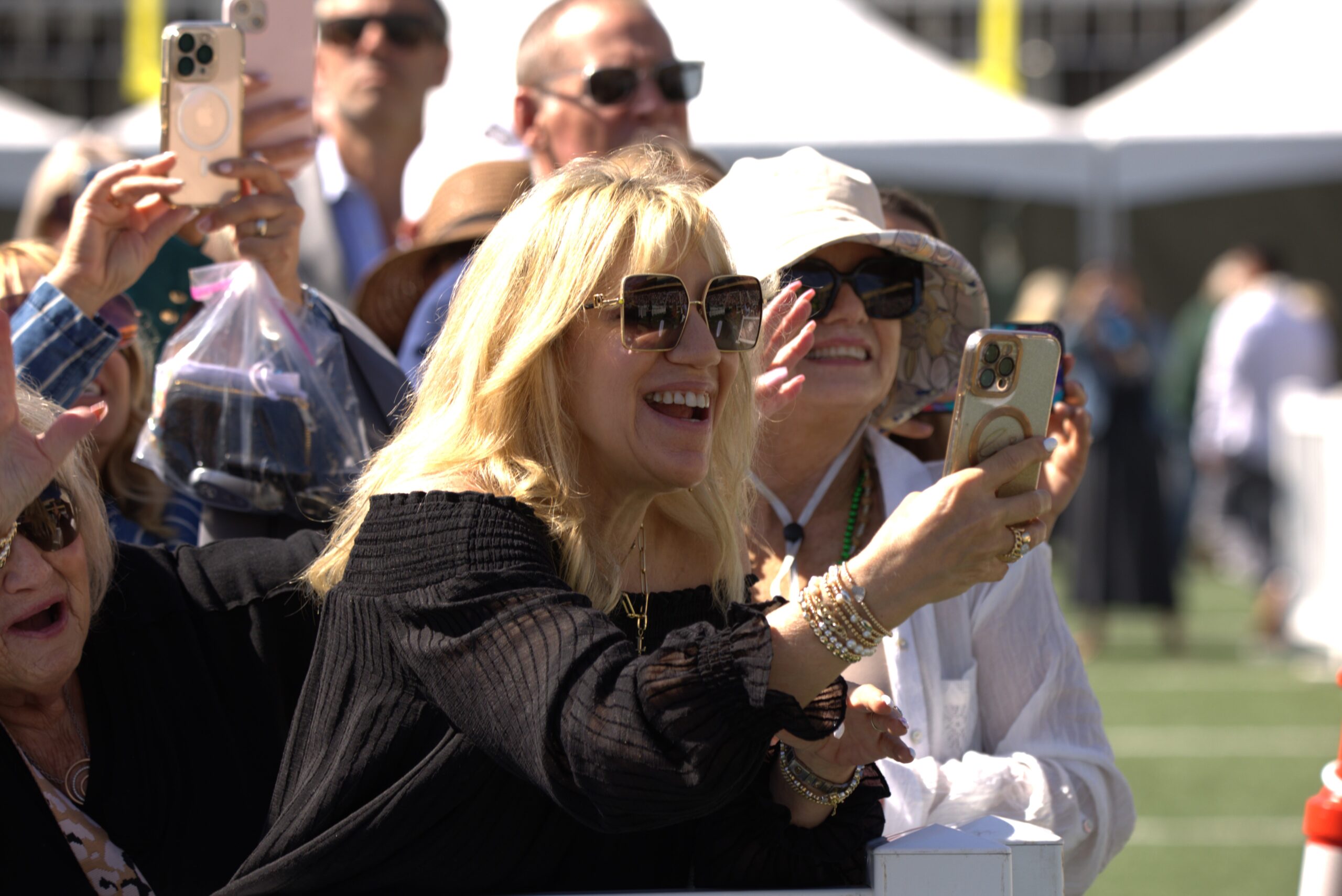 Proud family members take photos at commencement