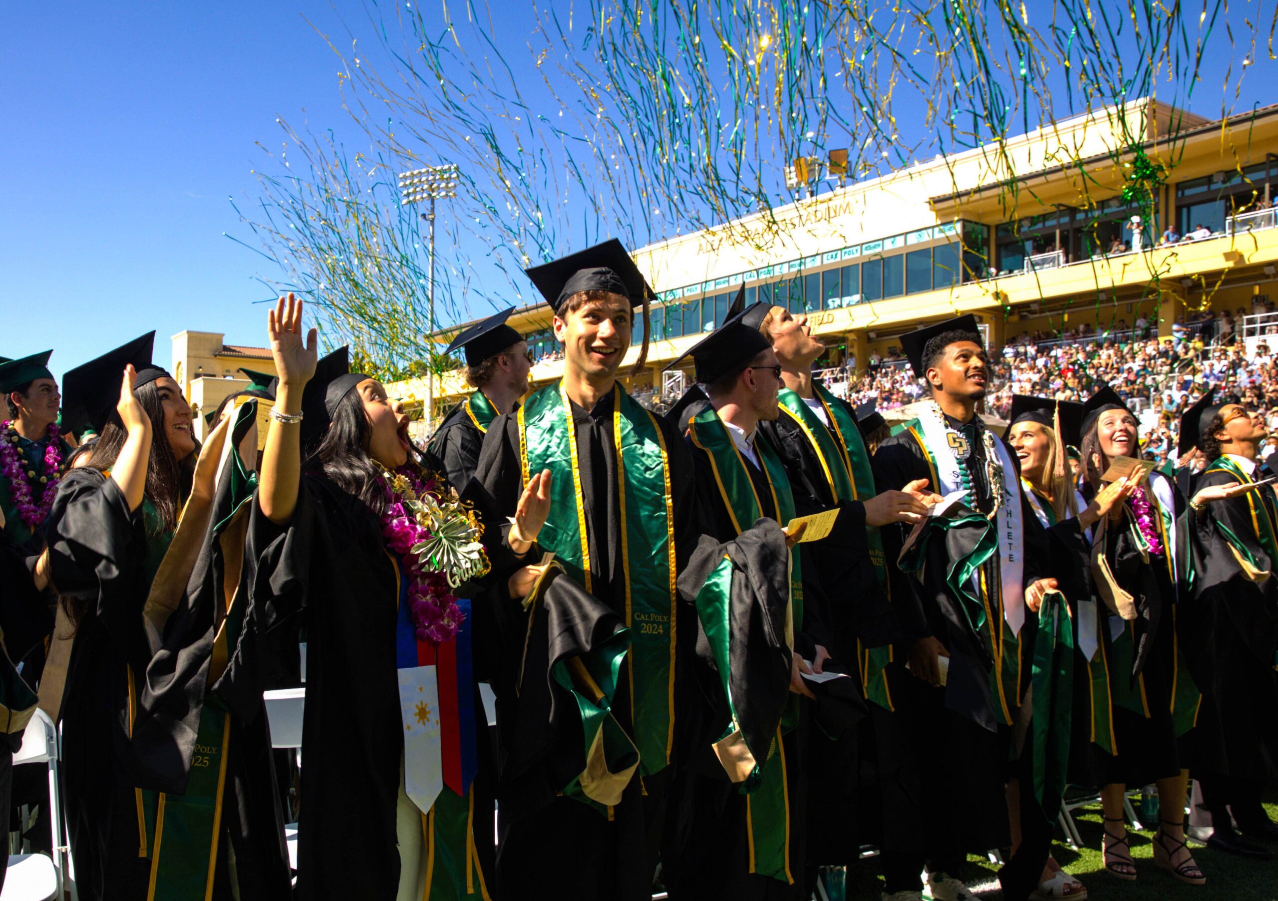 Streamers fall around students at commencement