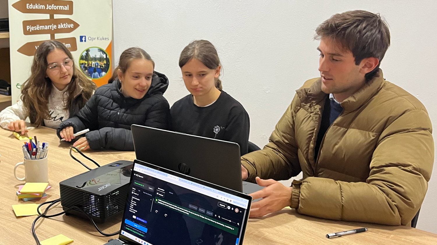 Benjamin Roe works with young students in Albania